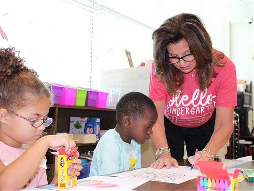 Teacher Helping Students